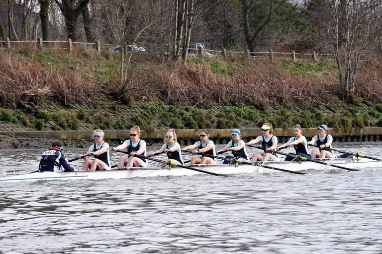 The winning women's eight racing along the Tideway